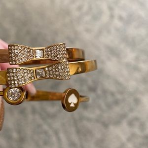 KATE SPADE set of 3 bangles! Great condition 2 gold one rose gold.